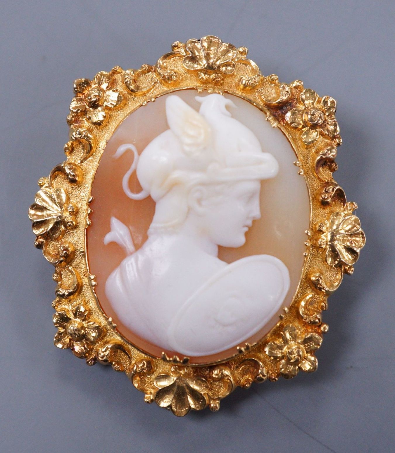 A Victorian yellow metal mounted cameo brooch carved with a bust of Hermes, 4.5cm